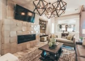 Thumbnail 4 of 37 - a living room with a fireplace and a television