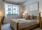 Thumbnail 14 of 22 - a bedroom with a bed and a window at Leena Plantation, Florida, 33322