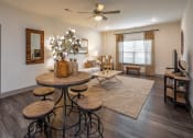 Thumbnail 20 of 37 - a dining room with tables and chairs and a ceiling fan