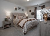 Thumbnail 23 of 37 - a bedroom with a bed and two nightstands and a window