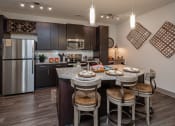 Thumbnail 17 of 37 - redesigned kitchen with stainless steel appliances and a granite island with stools