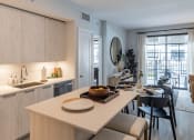 Thumbnail 10 of 22 - a kitchen and dining area in a 555 waverly unit at Leena Plantation, Florida