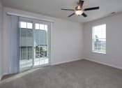 Thumbnail 17 of 27 - an empty bedroom with a ceiling fan