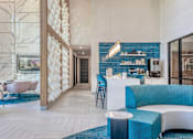 Thumbnail 4 of 29 - A modern interior with a blue and white color scheme.