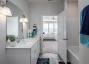 Thumbnail 6 of 27 - a bathroom with a sink and a mirror