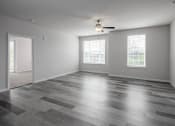 Thumbnail 16 of 27 - the living room with hardwood floors and a ceiling fan