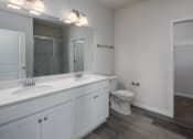 Thumbnail 18 of 27 - a bathroom with a toilet and a sink
