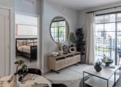 Thumbnail 12 of 22 - a living room with a large mirror on the wall at Leena Plantation, Florida