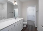 Thumbnail 16 of 23 - a bathroom with a toilet and a sink