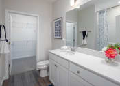 Thumbnail 8 of 23 - a bathroom with a toilet and a sink