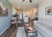 Thumbnail 5 of 23 - a living room with a couch and a coffee table