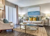 Thumbnail 10 of 34 - a living room with a couch and chairs and a coffee table at L'Estancia, Sarasota