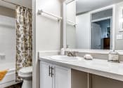 Thumbnail 13 of 34 - a bathroom with a shower and a sink and a toilet at L'Estancia, Sarasota, 34231