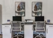 Thumbnail 7 of 34 - an office with three desks with computers and chairs at L'Estancia, Florida, 34231