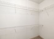 Thumbnail 19 of 35 - Empty white shelves in a room.