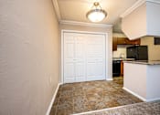 Thumbnail 16 of 30 - A white door in a room with a brown floor.