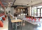 Thumbnail 23 of 46 - a dining room with tables and chairs and a kitchen in a loft