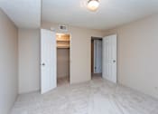 Thumbnail 13 of 41 - a kitchen with white cabinets and black appliances