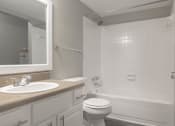 Thumbnail 21 of 41 - a bathroom with a sink toilet and bathtub