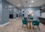 Thumbnail 22 of 32 - a dining room with a table and chairs and a kitchen