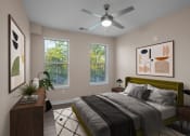 Thumbnail 7 of 32 - 2-Bedroom Apartments in Mt. Juliet, TN - The Enclave at Providence - Bedroom with Hardwood-Style Flooring, Area Rug, Bed, Nightstands with Lamps, Dresser, Ceiling Fan, and Two Windows.