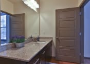 Thumbnail 30 of 36 - an empty bathroom with a sink and a mirror