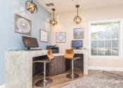 Thumbnail 5 of 18 - an office with two chairs and a desk with a window