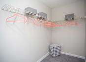 Thumbnail 15 of 16 - an empty room with a wire rack on the wall and a box on the floor