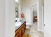 Thumbnail 17 of 31 - a bathroom with a sink and a toilet