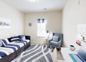Thumbnail 18 of 31 - a bedroom with a bed and a desk with a laptop
