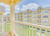 Thumbnail 24 of 29 - the view of an apartment building from a balcony