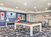 Thumbnail 18 of 30 - A room with a pool table and a sign that says Regatta 55.