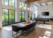 Thumbnail 7 of 22 - a dining room with a ping pong table and a foosball table  at Leena Plantation, Florida