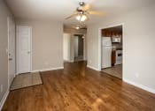 Thumbnail 5 of 26 - a living room with hardwood floors and a ceiling fan