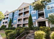 Thumbnail 35 of 38 - an apartment building with stairs in front of it