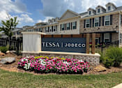 Thumbnail 1 of 65 - A sign that says Tessa Jodeco in front of a building.