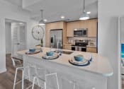 Thumbnail 17 of 78 - a kitchen with a counter top and a sink at Altis Blue Lake, Lake Worth, FL