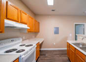 Thumbnail 23 of 69 - a kitchen with a stove top oven and a sink