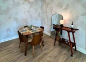 Thumbnail 4 of 29 - a dining room with two tables and a mirror