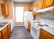 Thumbnail 24 of 69 - a kitchen with a stove refrigerator and sink