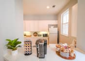 Thumbnail 14 of 31 - a kitchen with a coffee maker on the counter