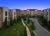 Thumbnail 40 of 41 - an aerial view of an apartment complex at dusk