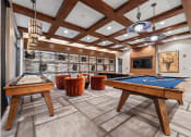 Thumbnail 10 of 41 - a billiards room with a pool table and tables