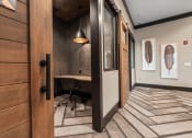 Thumbnail 5 of 41 - a conference room with a desk and a door to a hallway