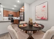 Thumbnail 23 of 41 - a kitchen and dining room with a table and chairs