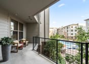 Thumbnail 27 of 41 - a balcony with a pool and a patio