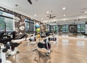 Thumbnail 16 of 41 - the gym has a slew of bikes and treadmills in it