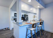 Thumbnail 2 of 32 - A kitchen with a blue countertop and white walls L'Estancia, Sarasota, FL, 34231
