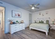 Thumbnail 7 of 32 - A bedroom with a bed, nightstand, and a white dresser L'Estancia, Sarasota, FL, 34231