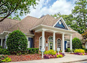 Thumbnail 18 of 18 - A house with a blue door and white columns.